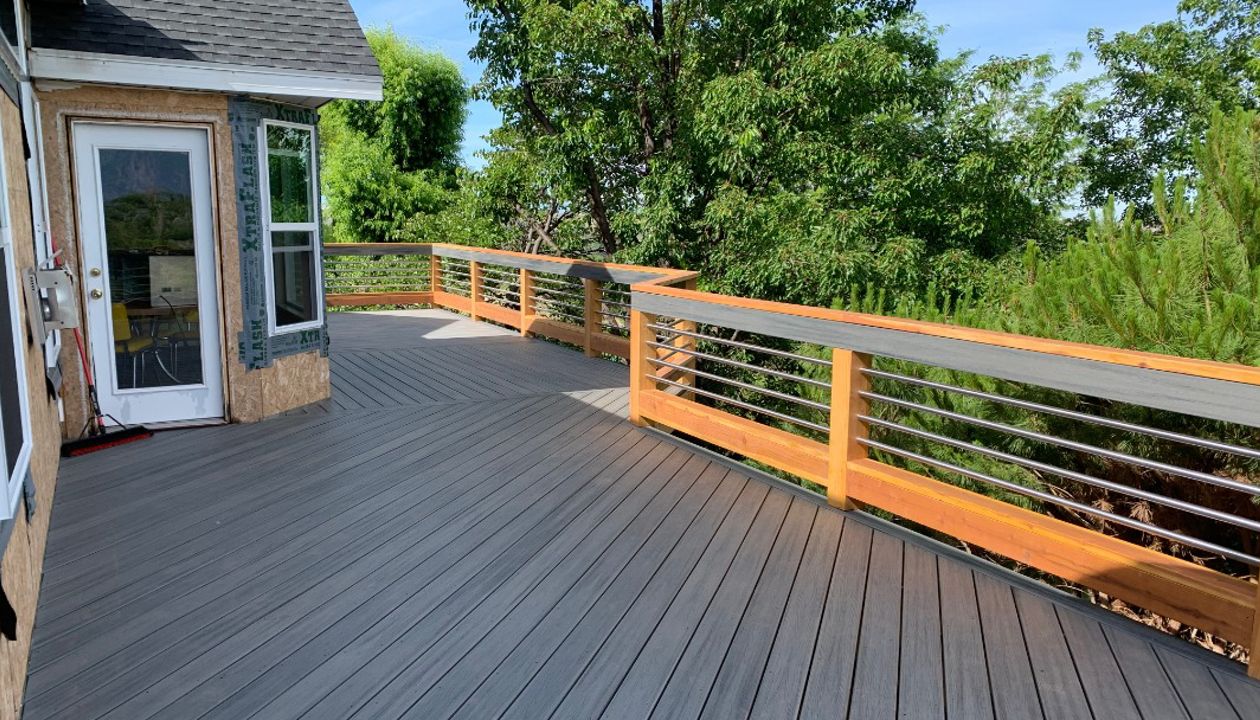 Trex Transcend Island Mist with custom built stainless steel/ redwood railing with Trex Transcend Drink Rail in Weber County, Ut