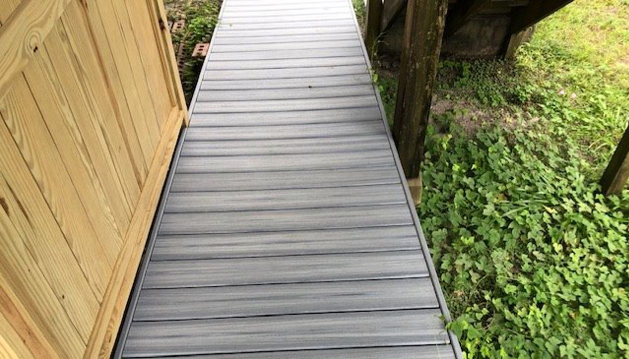 This Trex Enhance Naturals Foggy Wharf ramp & shower area are welcoming to any beach guest