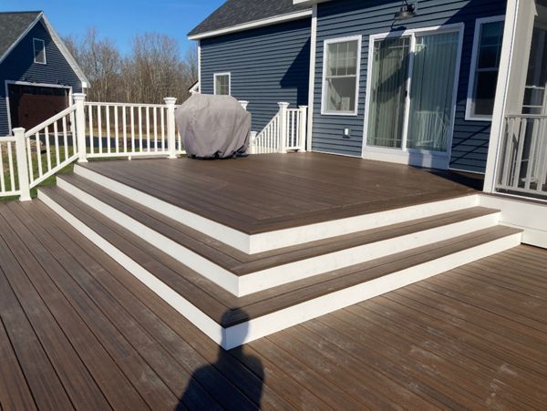Trex Decking and railing with recessed hottub and pool.