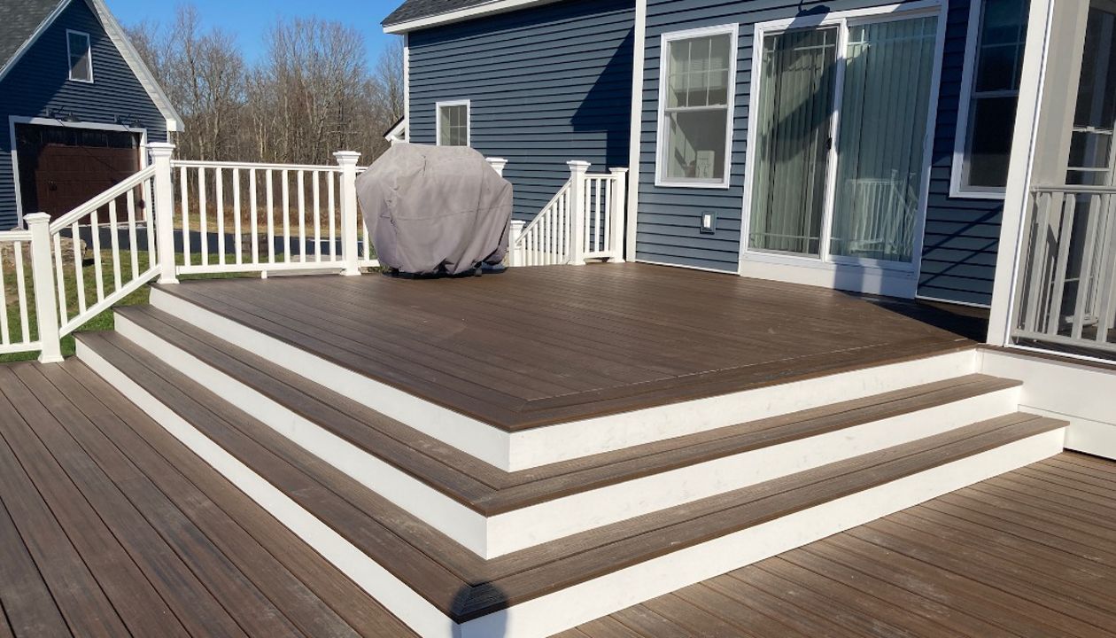 Trex Decking and railing with recessed hottub and pool.