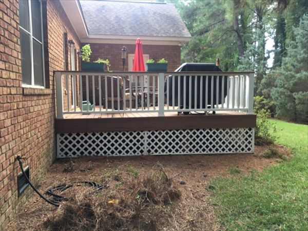 Trex Transcend Tiki Torch deck looks great against this brick home.