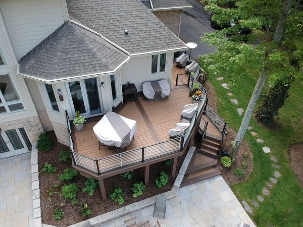 Trex Havana Gold decking with a double Spiced Rum border. Also including a Trex Signature Platinum Rod Railing.
