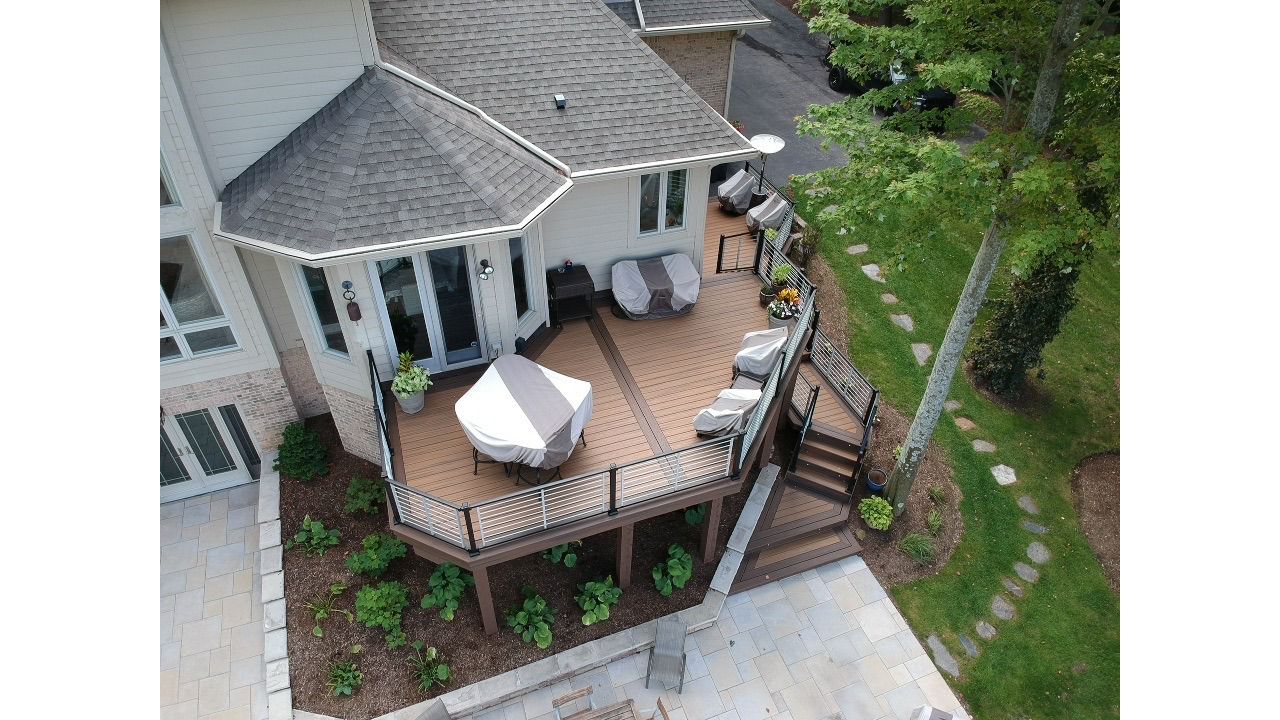 Trex Havana Gold decking with a double Spiced Rum border. Also including a Trex Signature Platinum Rod Railing.