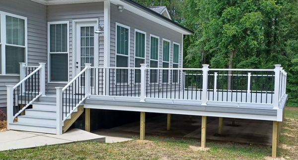 Trex Enhance Naturals Foggy Wharf deck is trimmed out with a deck board on the perimeter