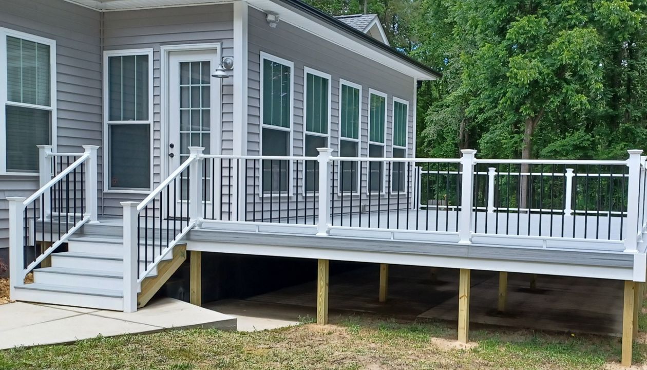 Trex Enhance Naturals Foggy Wharf deck is trimmed out with a deck board on the perimeter