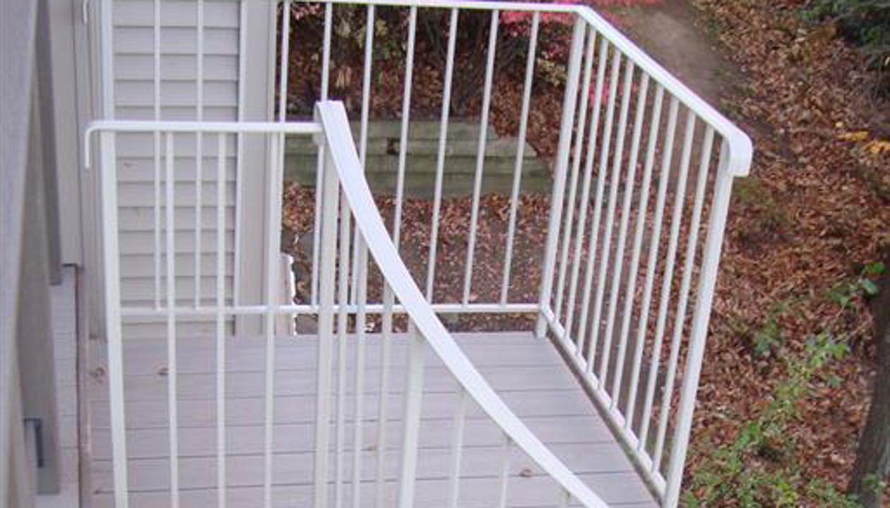 Trex Transcends deck with spiral stairs in Farmington hills , Michigan