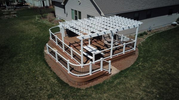 Rexburg, ID Trex Deck featuring Tiki Torch deck with Select railing and Trex Pergola