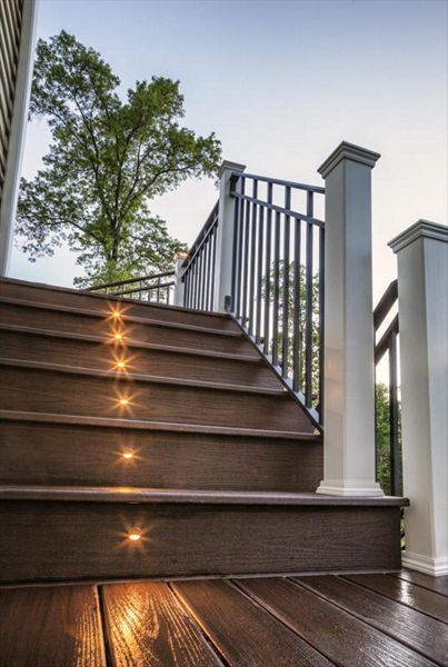 Bronze Trex riser lights were as good as gold with the homeowners of this majestic staircase and deck in Bridgewater, N.J.