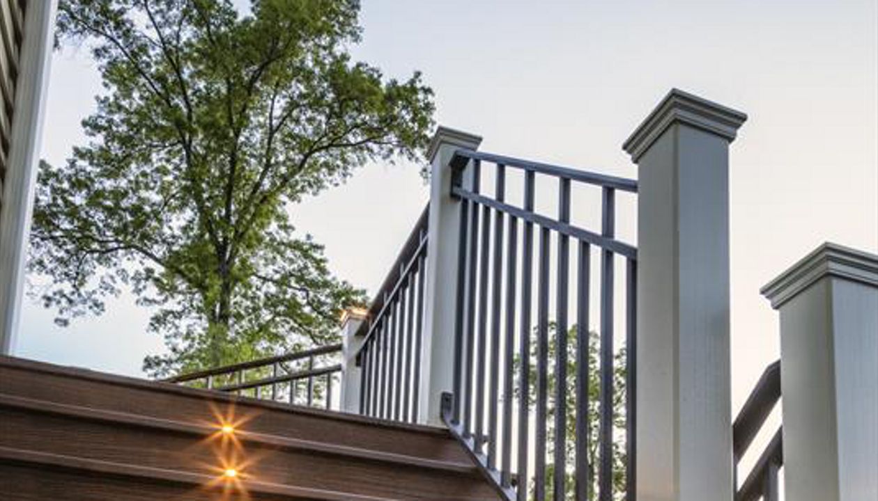Bronze Trex riser lights were as good as gold with the homeowners of this majestic staircase and deck in Bridgewater, N.J.