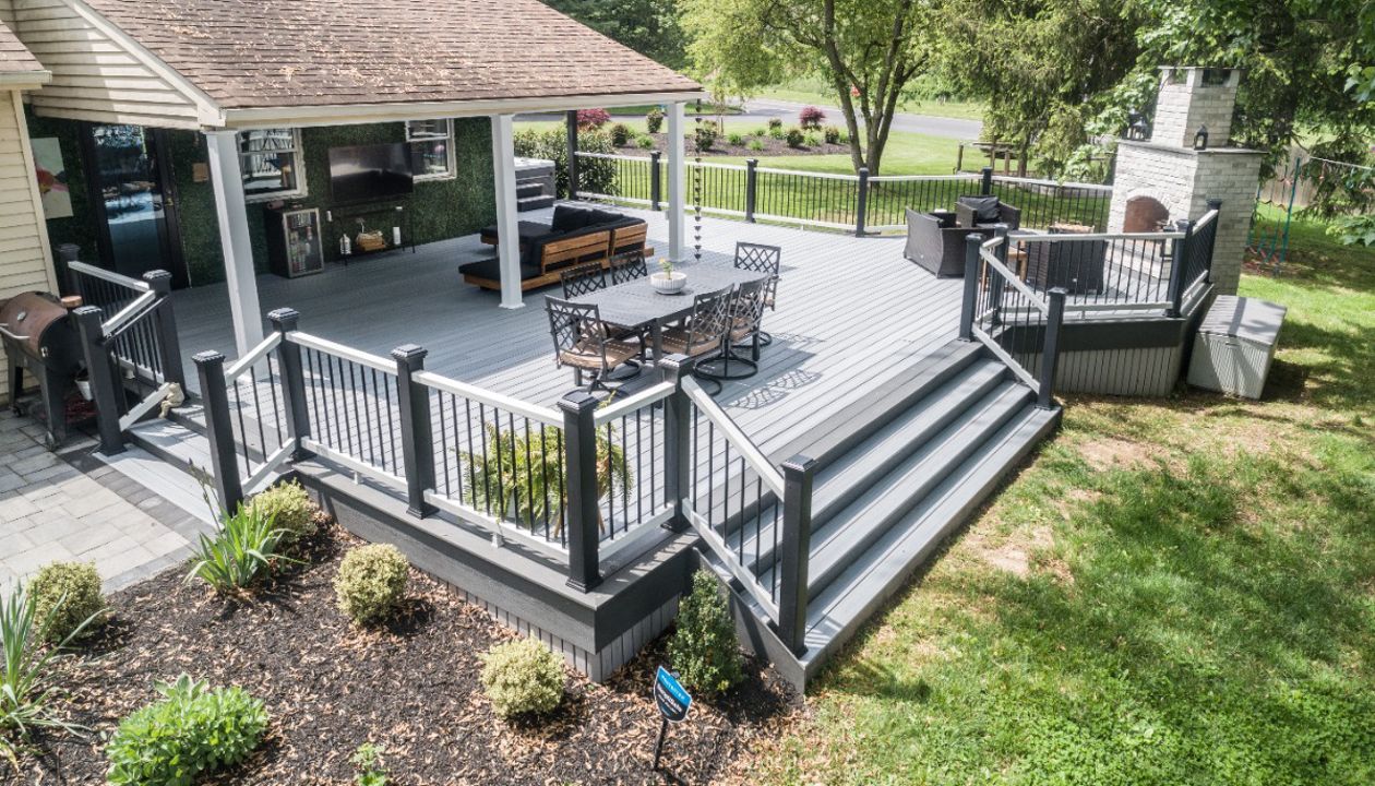 Trex Deck with Island Mist Decking & Trex Select Railing and Custom Fireplace