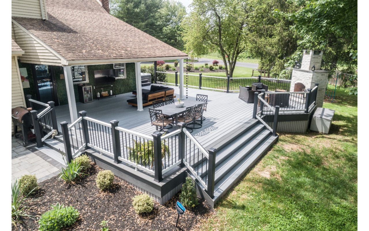 Trex Deck with Island Mist Decking & Trex Select Railing and Custom Fireplace
