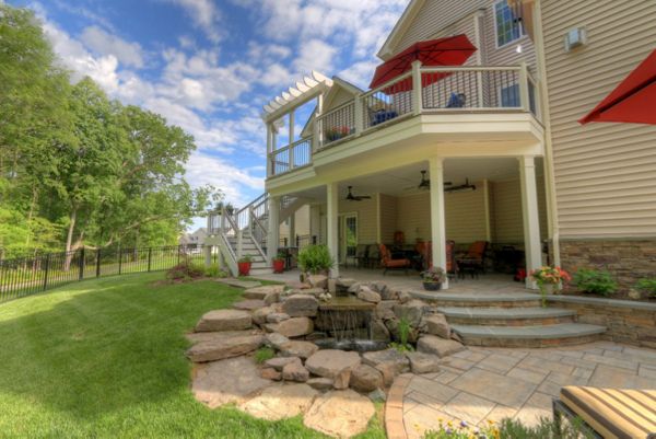 Trex Transcends Deck with Rain Escapes, Water Feature, & Custom Patio