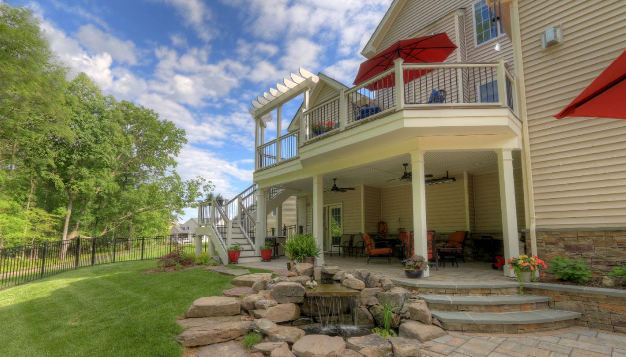 Trex Transcends Deck with Rain Escapes, Water Feature, & Custom Patio