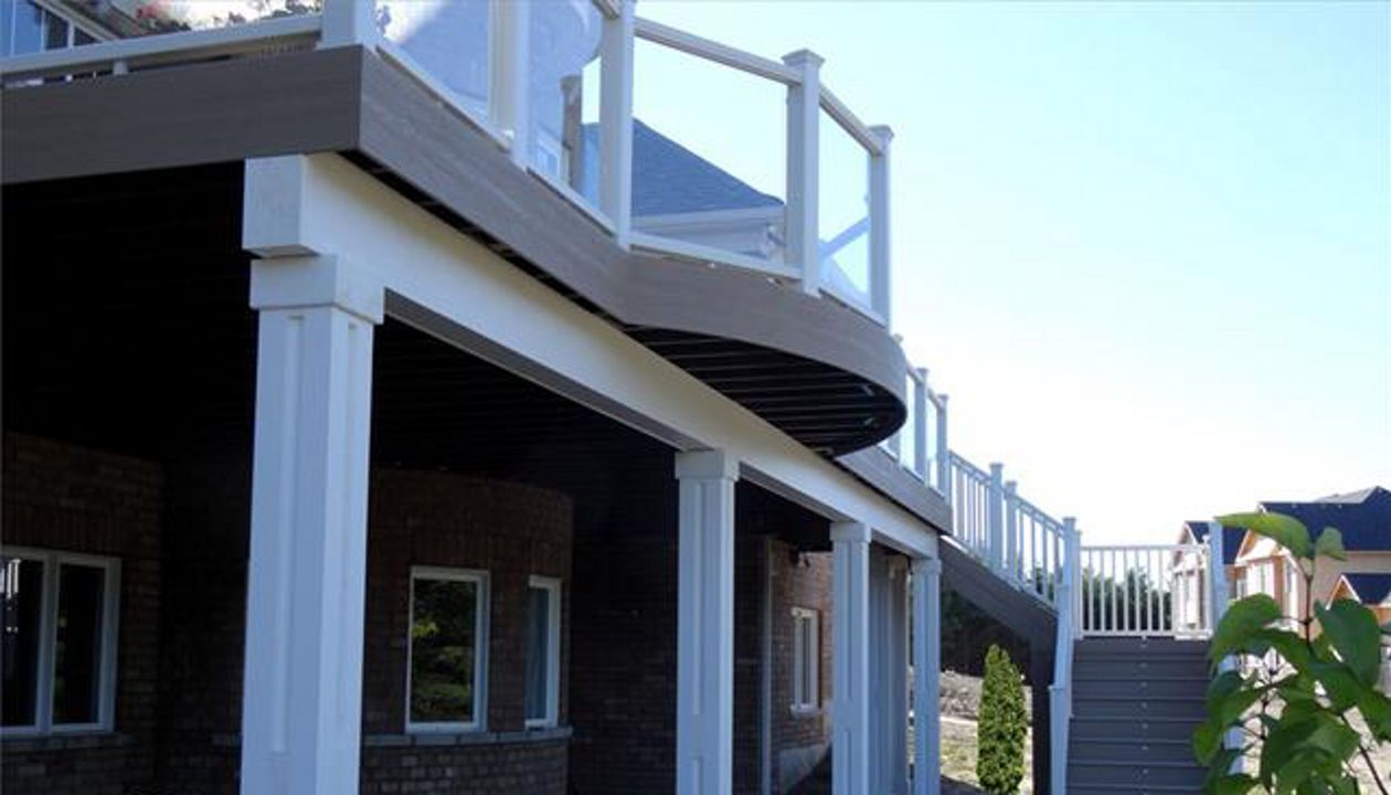 Curved deck using Elevations by Your Deck Co. in Caledon