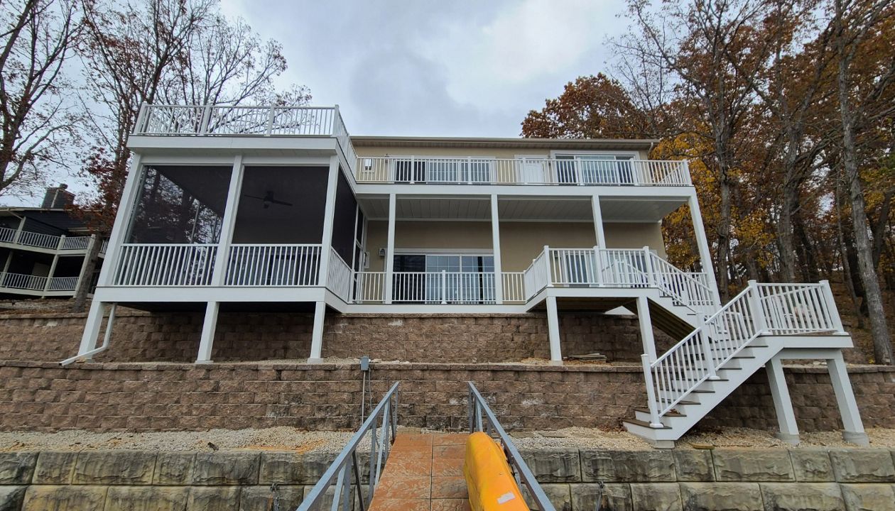 Large deck with screened in room with ceiling fan. Decking is Toasted Sand done in Lake Ozark, MO