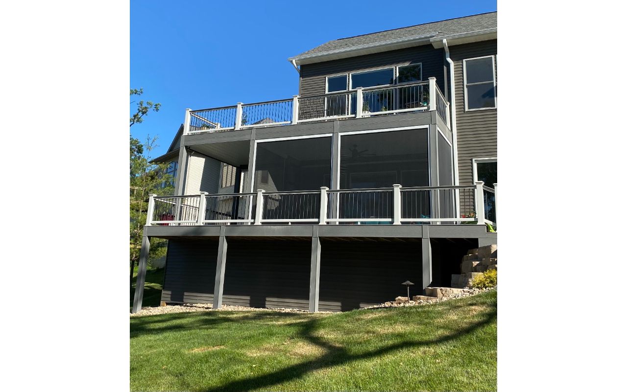 Trex Select Pebble Gray Decking, Select Railings, Rain Escapes Ceiling, Phantom Screens, 2 Level Deck, & A Bonus Storage Room Below