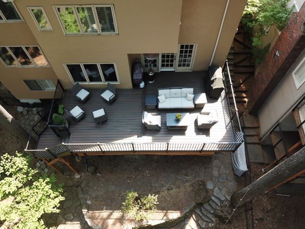 Lake Oswego, OR Trex deck featuring Trex Spiced Rum decking and fascia with fascia mount Trex Signature railing with lighted caps