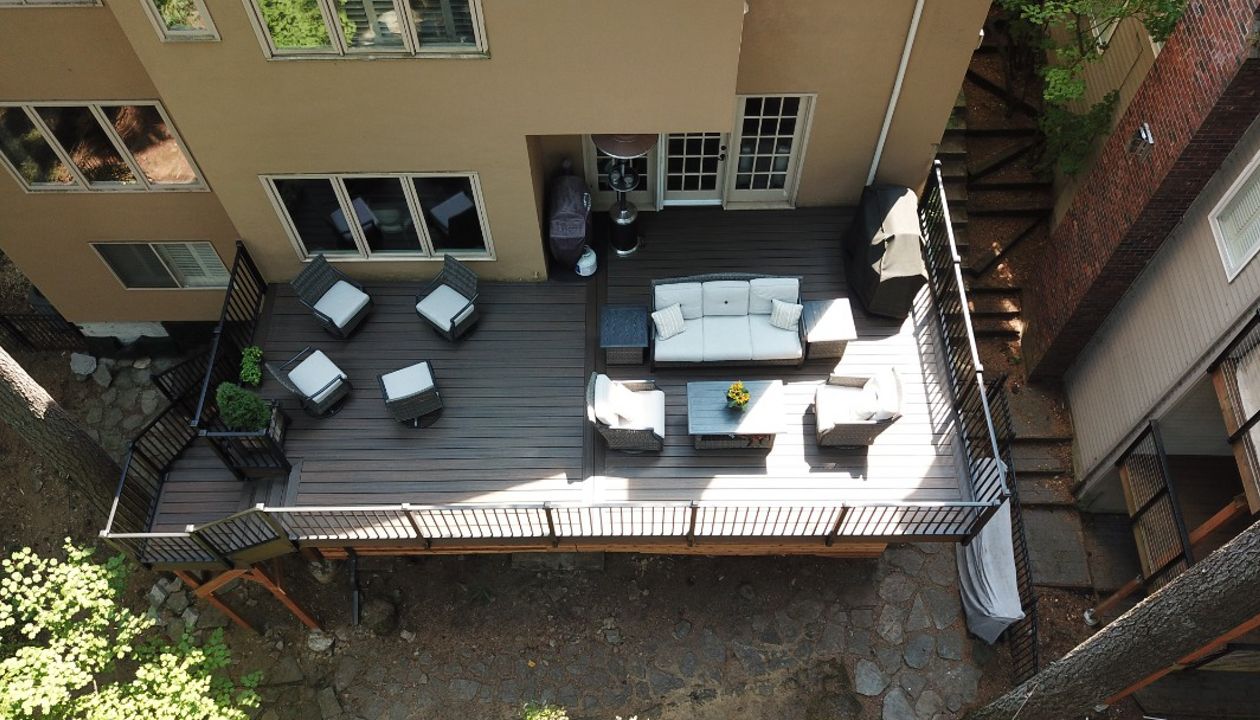 Lake Oswego, OR Trex deck featuring Trex Spiced Rum decking and fascia with fascia mount Trex Signature railing with lighted caps