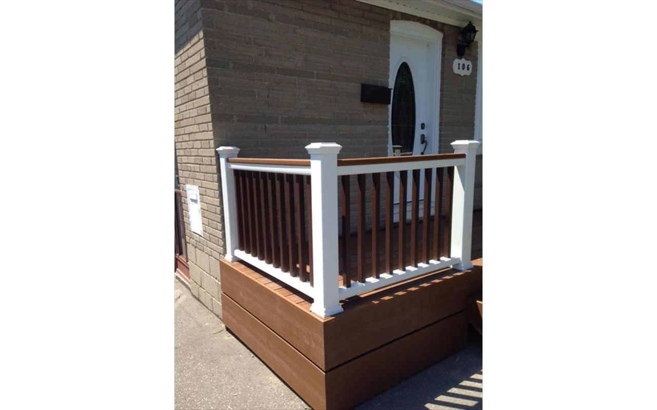 Trex Select Saddle custom made COMPOSITE porch with Trex Select Madeira railing and classic white posts. The Porch built in Toronto, Mississauga, Scarborough, Etobicoke, North York, Markham, RTrex