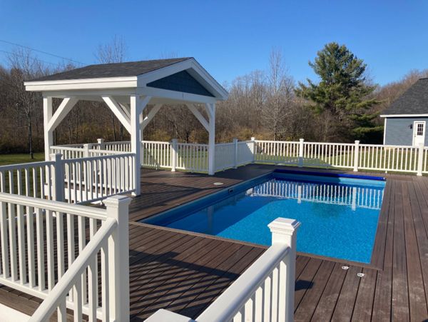 Trex Decking and railing with recessed hottub and pool.