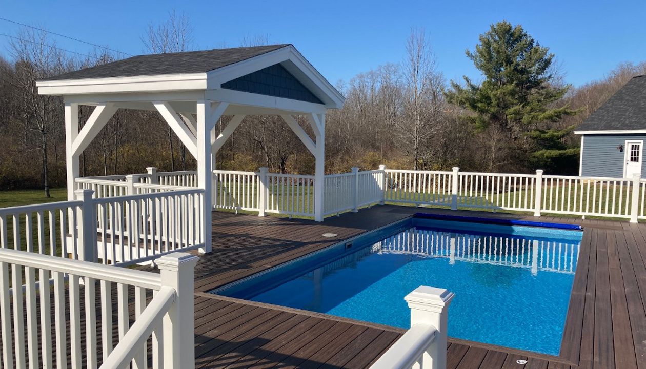Trex Decking and railing with recessed hottub and pool.