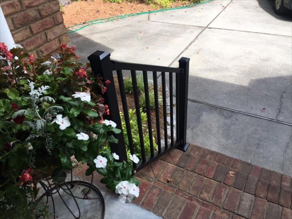 Trex Signature Black railis pair well with this brick porch.