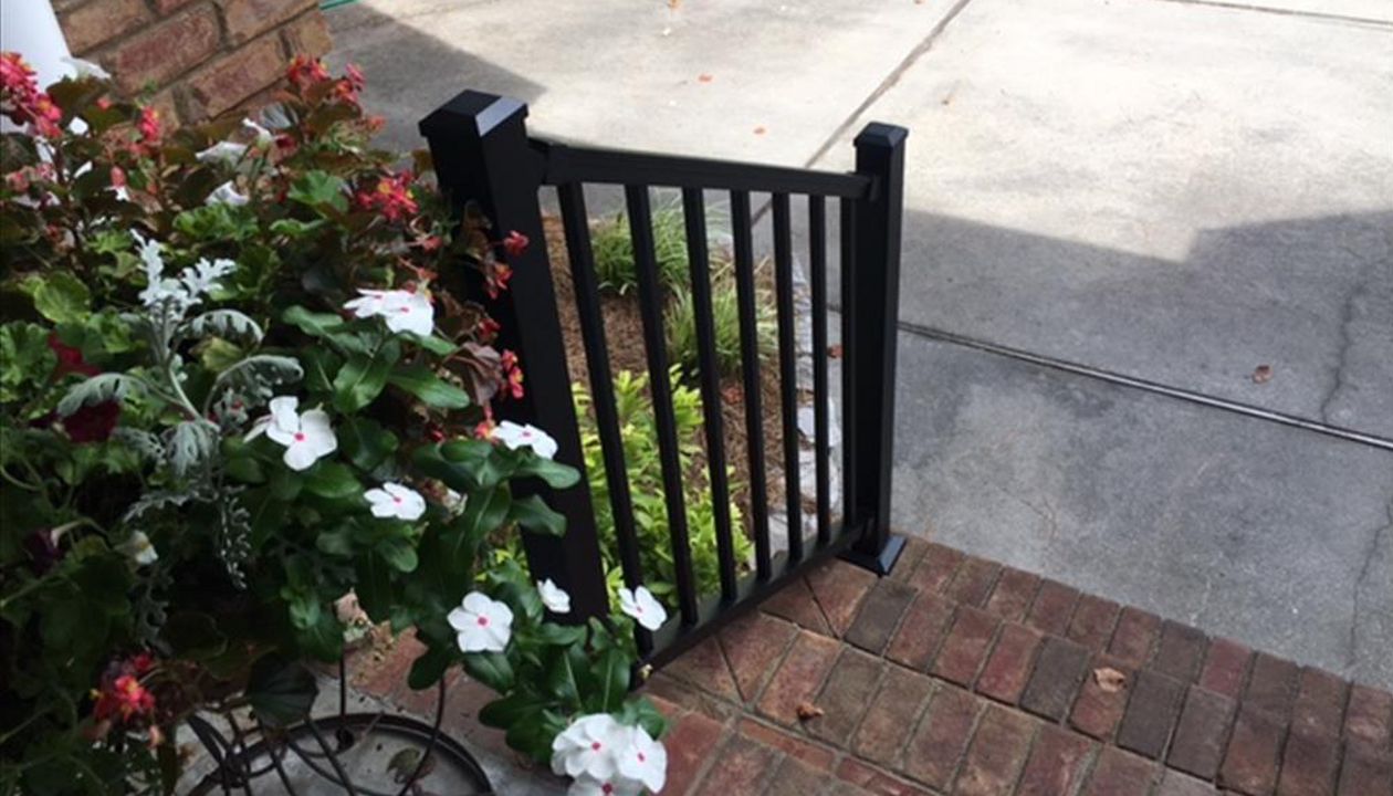 Trex Signature Black railis pair well with this brick porch.