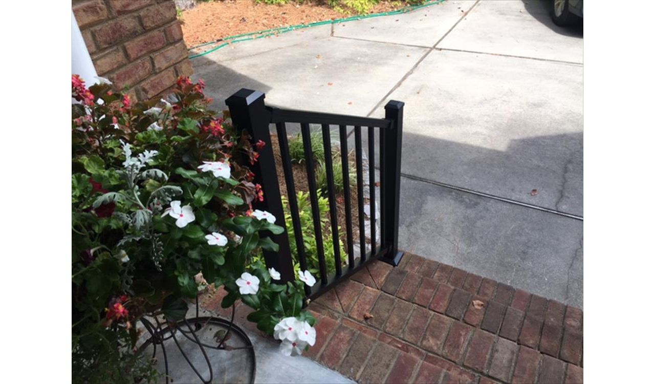 Trex Signature Black railis pair well with this brick porch.