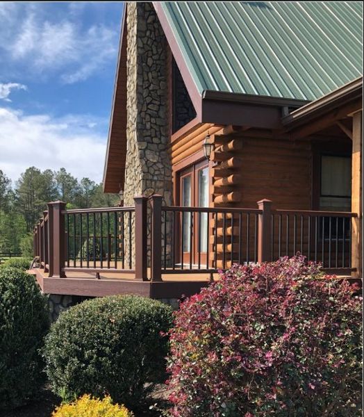 Side view of entrance for Trex Transcend Havana Gold deck with Transcend Fire Pit Railing and Fascia