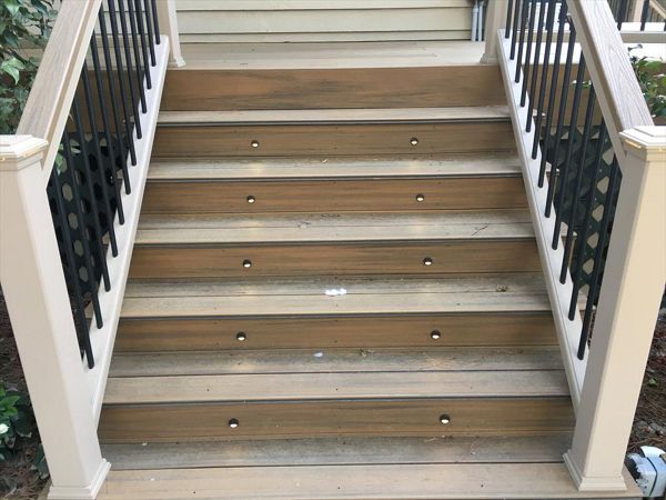 Trex Transcend stairs with black riser lights provide a safe way to come up on this deck and have a great time!