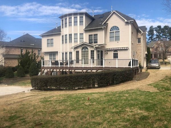 Majestic new Trex Select Saddle deck with Transcend Classic White Railing, LED lighting & RainEscape!