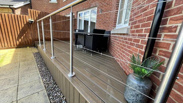 Stunning little deck in toasted sand from the trex naturals range finished off with stainless steel railings