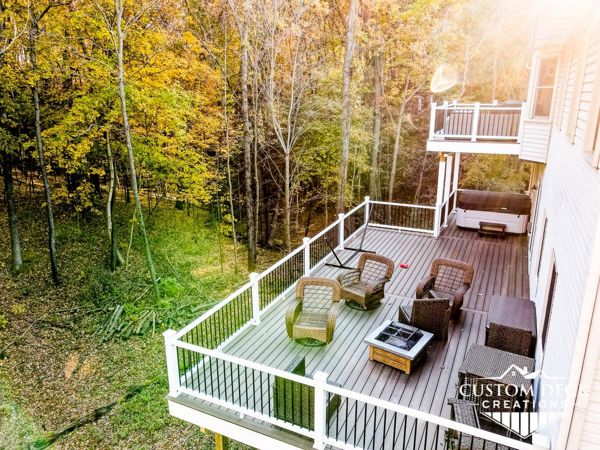 Trex Enhance Naturals decking in Coastal Bluff. White Azek PVC fascia.