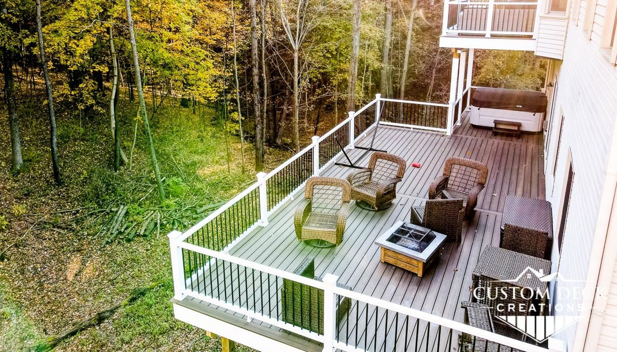 Trex Enhance Naturals decking in Coastal Bluff. White Azek PVC fascia.