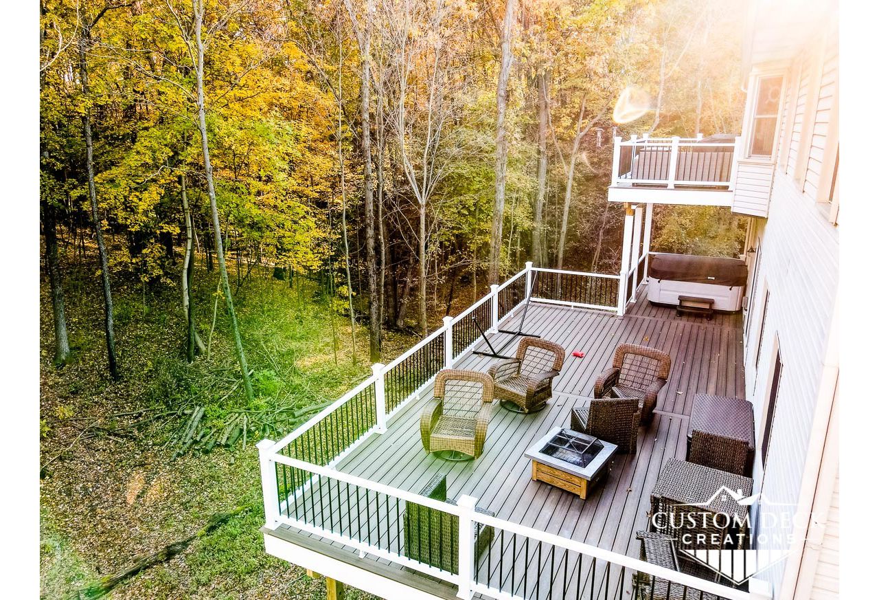 Trex Enhance Naturals decking in Coastal Bluff. White Azek PVC fascia.