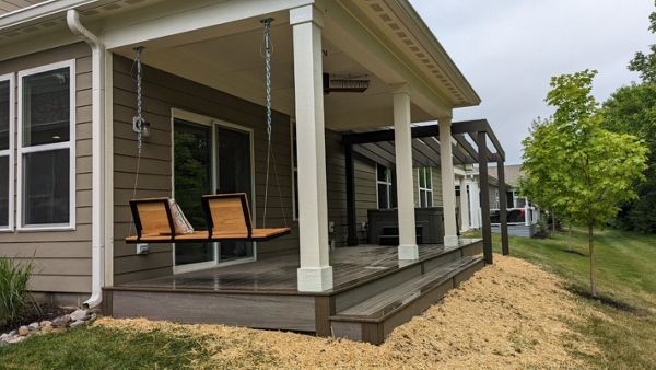 Trex Enhance Naturals in Rocky Harbor and Coastal Bluff with custom pergola over new concrete hot tub slab.