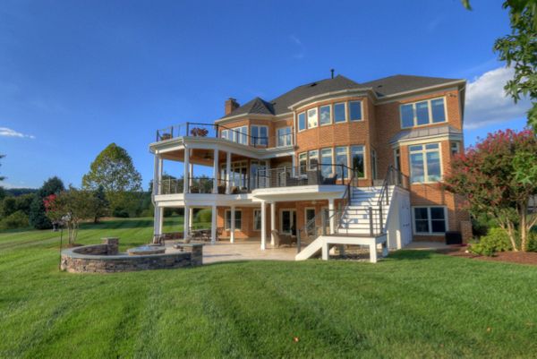 Trex Transcends Deck, Open Porch, Rain Escapes, Cable Rail System, & Travertine Patio