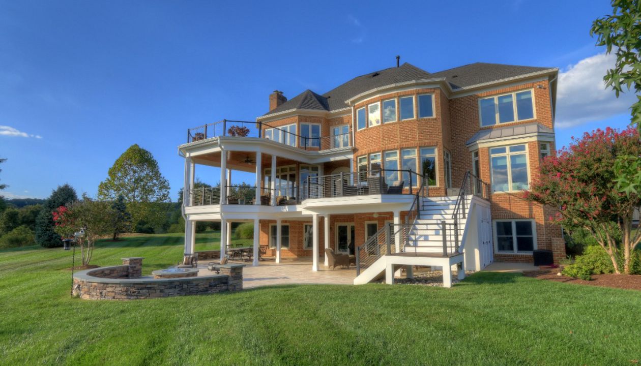 Trex Transcends Deck, Open Porch, Rain Escapes, Cable Rail System, & Travertine Patio