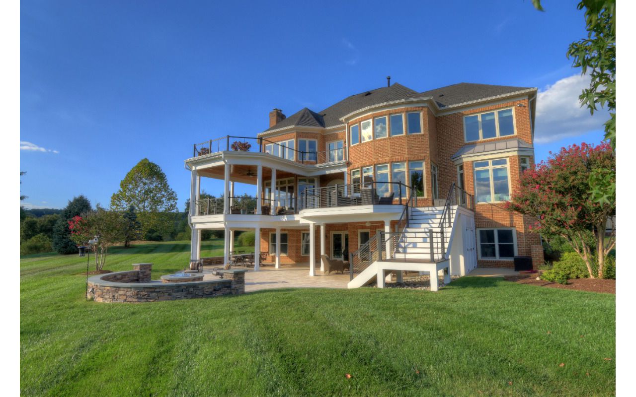 Trex Transcends Deck, Open Porch, Rain Escapes, Cable Rail System, & Travertine Patio
