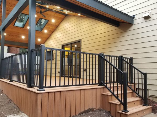 Transcend Tiki Torch decking, Signature railing, lighted post caps, and riser lights