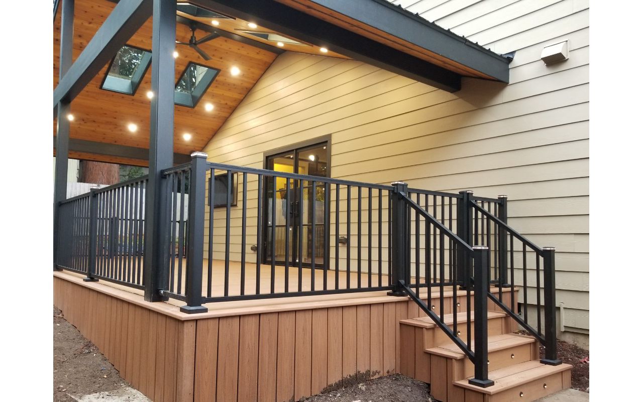Transcend Tiki Torch decking, Signature railing, lighted post caps, and riser lights
