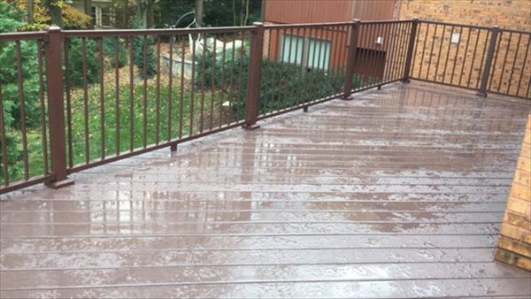 Aluminum railing is becoming more and more popular every year. This deck features Trex Signature aluminum railing in bronze.