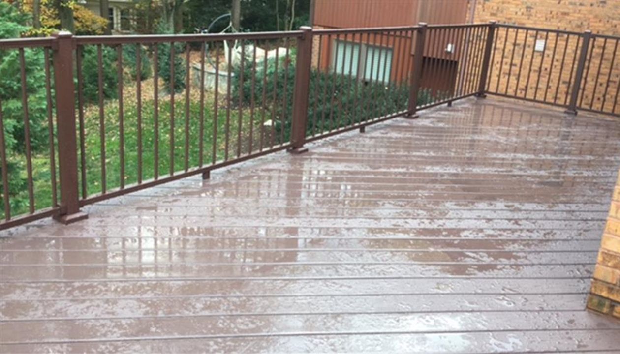 Aluminum railing is becoming more and more popular every year. This deck features Trex Signature aluminum railing in bronze.