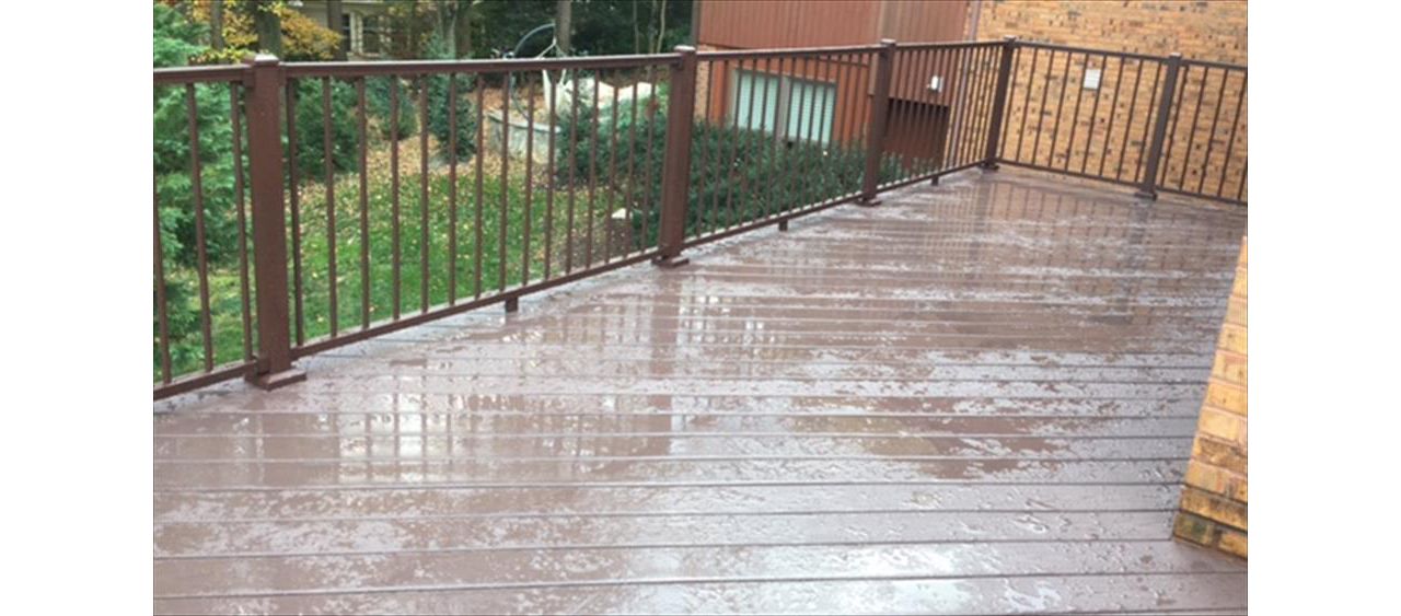 Aluminum railing is becoming more and more popular every year. This deck features Trex Signature aluminum railing in bronze.