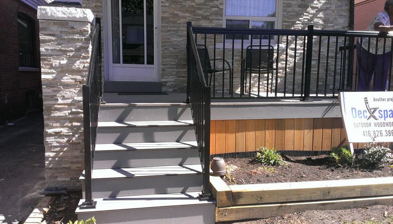Trex Transcend Gravel Path custom made COMPOSITE porch with black aluminum railing and solid skirting.The Porch built in Toronto, Mississauga, Scarborough, Etobicoke, North York, Markham, Richmond Hill, Thornhill, Vaughan