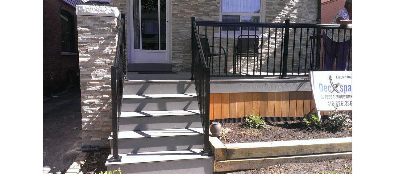 Trex Transcend Gravel Path custom made COMPOSITE porch with black aluminum railing and solid skirting.The Porch built in Toronto, Mississauga, Scarborough, Etobicoke, North York, Markham, Richmond Hill, Thornhill, Vaughan
