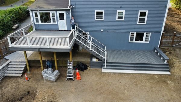 Beautiful 2-Tier Outdoor Living Space, Trex Transcend Island Mist and Trex Transcend Railings With Cocktail Rails, in Ipswich, MA