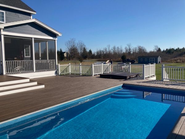Trex Decking and railing with recessed hottub and pool.