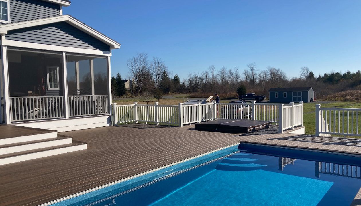Trex Decking and railing with recessed hottub and pool.