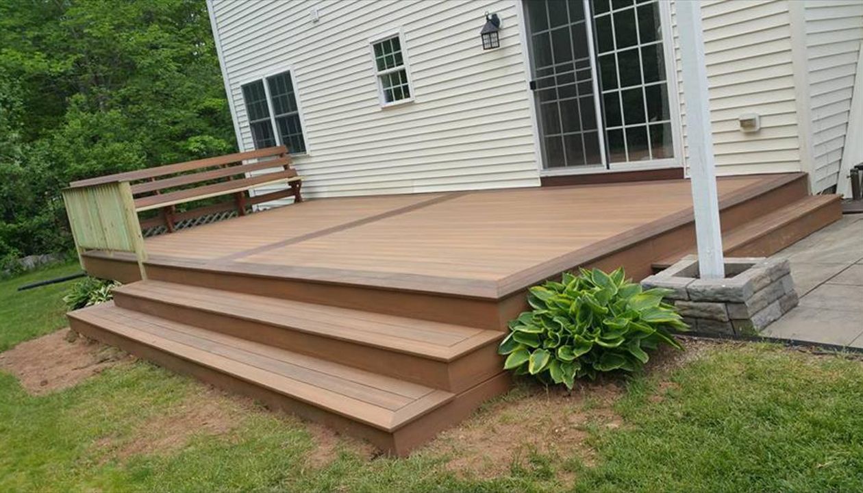 Ground Decks using Composite Decking in Meriden CT. Ground decks can be hardwoods decks like Ipe go great with Trex Railings and Trex outdoor storage.  Pressure Treated decks too